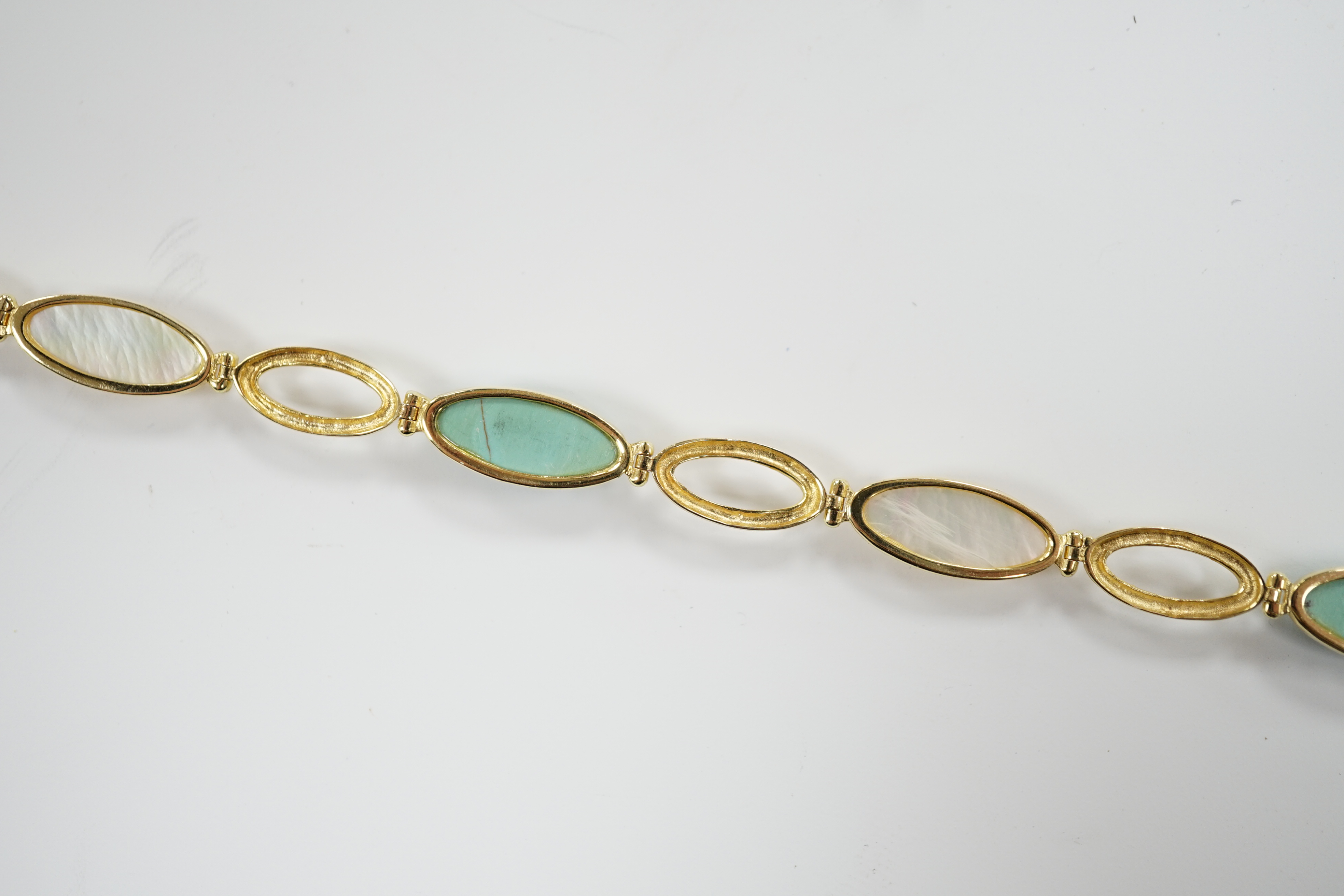 A modern 14k, mother of pearl and turquoise set bracelet, 18cm, gross weight 6.2 grams. moonstone and 14k bracelet
